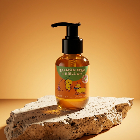 Bottle of salmon fish and krill oil on a stone surface with a warm background